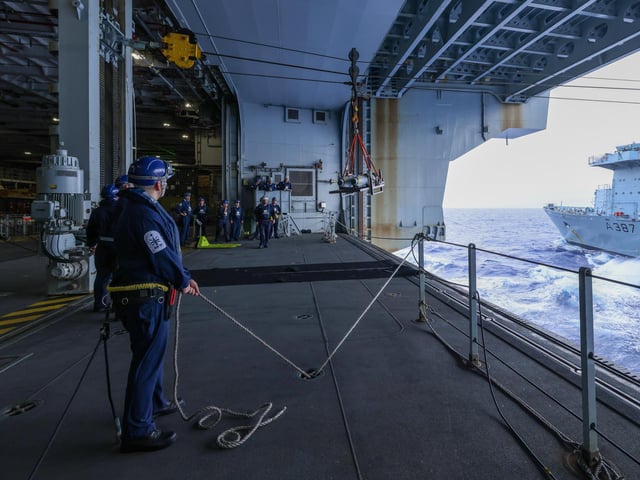 While deployed with the UK Carrier Strike Group in August 2021, HMS Queen Elizabeth completed a transfer of live munitions from solid support ship RFA Fort Victoria