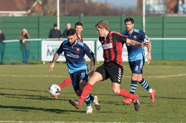 Fareham Town's ex-Royals striker Simon Woods in action against AFC Portchester at Cams Alders in 2018/19. Steve Ramsey - the highest scorer in 'El Creekio' Wessex derby history - is on the right. Picture: Vernon Nash