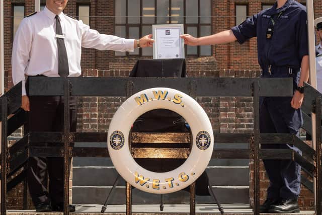 Engineering Technician (ET) Jordan Dalgleish, right, received the Herbert Lott Award from officer commanding weapon engineering training group Commander Jonathan Pearce in a socially-distanced ceremony at HMS Collingwood..