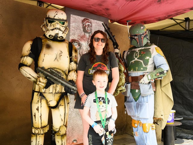 Ezra Harn and Paris Nicholson with two Star Wars Characters in front of Hans Solo in Carbonite. Picture: Keith Woodland (110521-32)