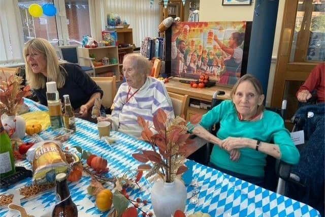 Prost! Residents raise a cheer at Bedhampton Court’s Oktoberfest.