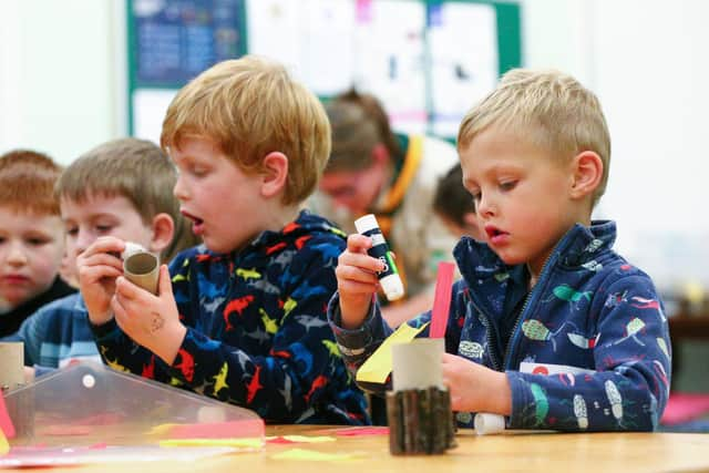 George Allen-Kotze, 5, right, making a tissue paper campfire. 
Picture: Chris Moorhouse   (jpns 031121-29)