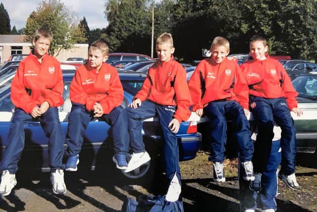 Christian Burgess (far left) sat next to Jack Wilshere during their Arsenal youth days together