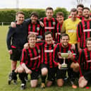 Dave Bridger holds the Len Den Cup as Carberry celebrate their 2-0 win over Horndean United in 2016/17. Picture: Kevin Shipp