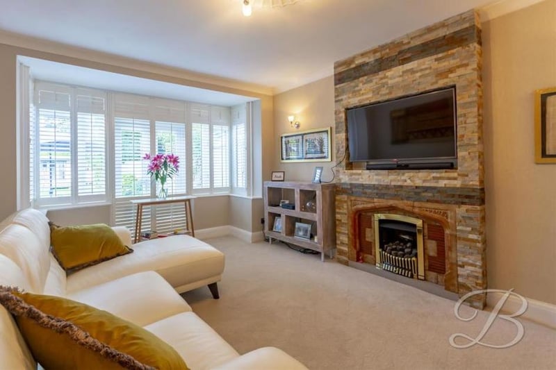 One of the most appealing parts of the house is this sitting room. With a carpeted floor, a fitted gas fireplace and bay window to the front, it provides all the necessary home comforts and also offers wooden plantation shutters that cool the room in summer and hold the heat in during winter..