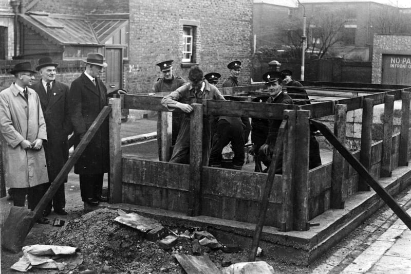 The erection of a concrete water tank by members of the National Fire Service. Exact location and date unknown