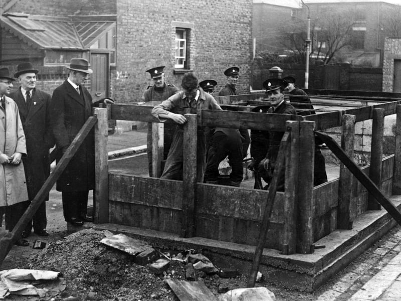 The erection of a concrete water tank by members of the National Fire Service. Exact location and date unknown