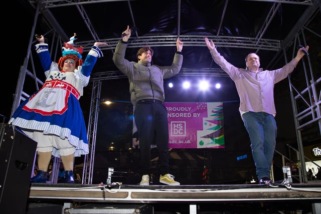 Hundreds of residents descended on Commercial Road to watch local dance troops and celebrities come together to turn on the Christmas lights.

Pictured - James Argent and Shaun Williamson sang YMCA to the crowds

Photos by Alex Shute