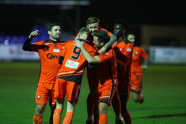 Lee Wort is mobbed after firing AFC Portchester ahead against Fareham Town. Picture: Stuart Martin (220421-7042)