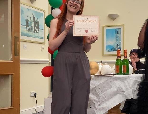 A well-deserved moment of recognition, celebrated by residents for their support and kindness.
