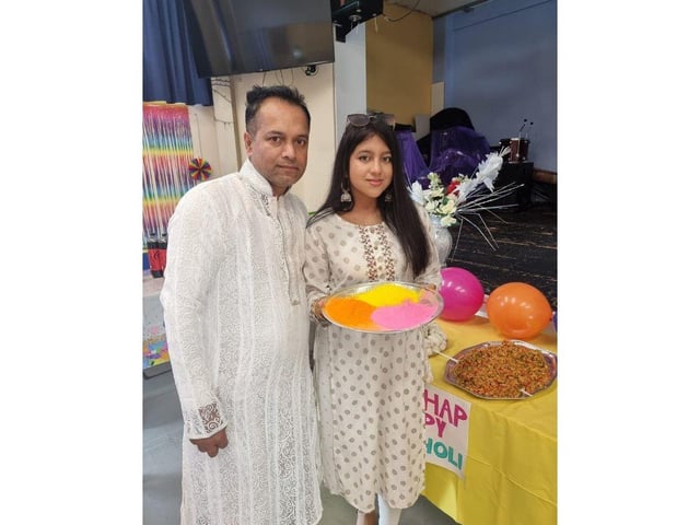 Sapan Ghosh and his daughter Simran get ready to start the festivities.