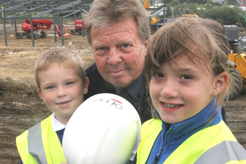 Abercrombie primary pupils Joseph Woods and Aimee Smith with Headteacher Niel Oates at the site of the new school.