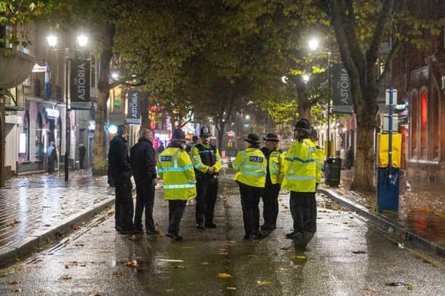 Police in Guildhall Walk, Portsmouth, on a Saturday night in November after a stabbing at a club.