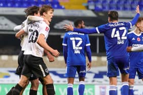 Sean Raggett celebrates his winner at Ipswich.  Picture: Nigel Keene