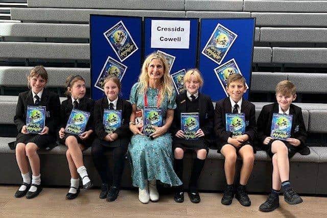 Cressida Cowell with schoolpupils.