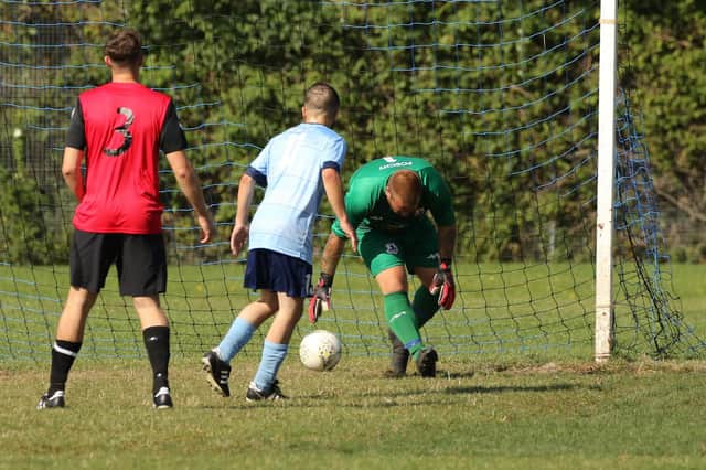 Wymering (red) score against Portchester Rovers. Picture: Kevin Shipp