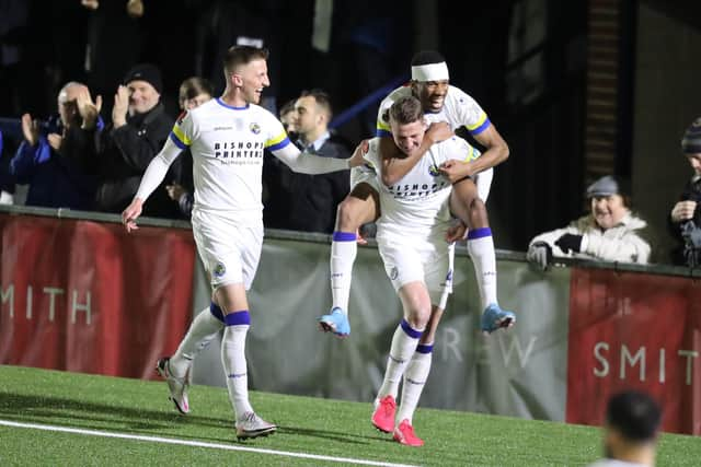 Joe Oastler  is congratulated after scoring one of his two goals in the 4-0 home win over Hungerford last March. Picture by Dave Haines.