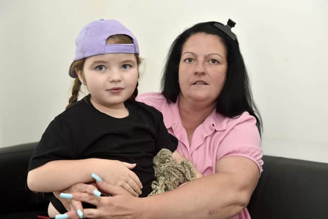 Amy Beveridge from Copnor, alongside her daughter Polly. A special school place has not been allocated for her daughter. Picture: Sarah Standing (100823-7671).