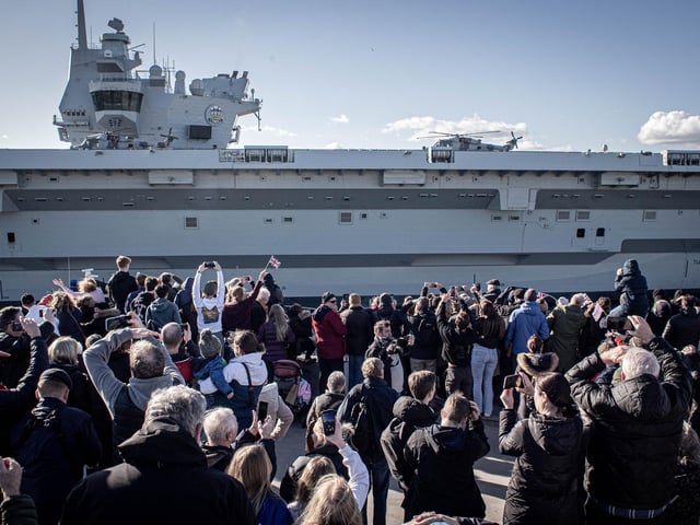 People waving goodbye to the Royal Navy aircraft carrier as she leaves Portsmouth. Picture: Habibur Rahman