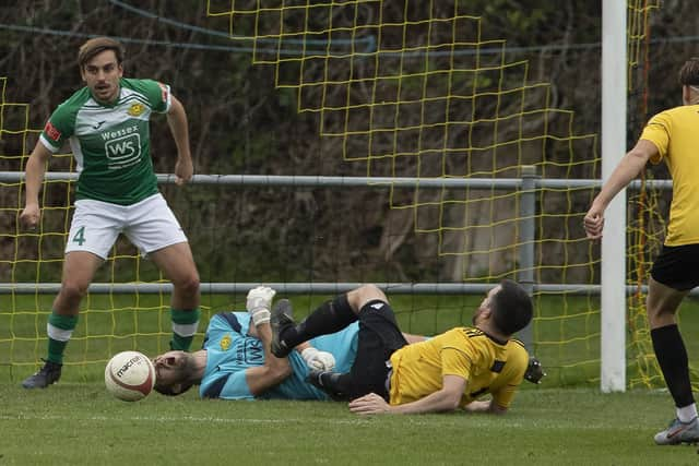 Moneyfields keeper Tom Price collides with Littlehampton's Liam Humphries. Picture: Chris Hatton