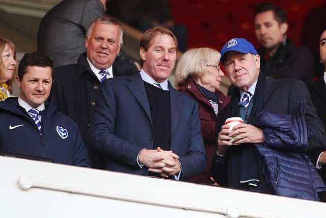Pompey chairman Michael Eisner, right, with son Eric and Andy Redman, left
