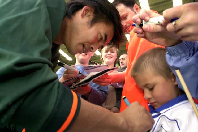 Yoshi Kawaguchi signs autographs at Steve Claridge's benefit match in May 2003. Picture: Malcolm Wells