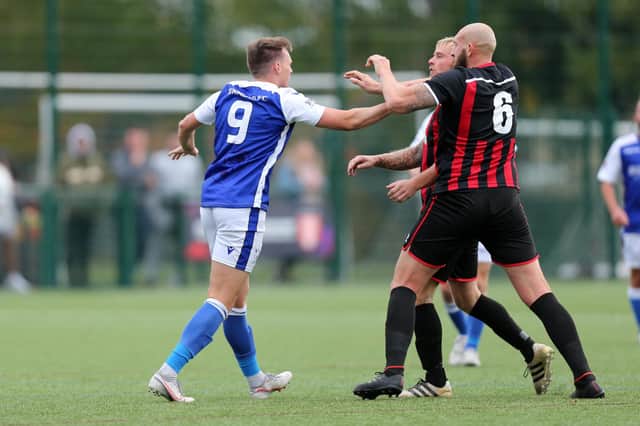 Tempers rise during Denmead's HPL Cup loss to Fleetlands - Keiran Hammond (left) and Jim Duffin. Picture: Chris Moorhouse