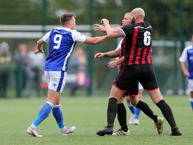 Tempers rise during Denmead's HPL Cup loss to Fleetlands - Keiran Hammond (left) and Jim Duffin. Picture: Chris Moorhouse