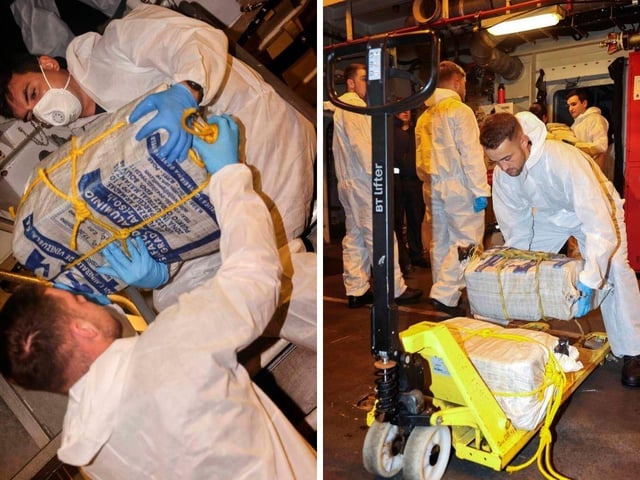 Sailors recovering bales of narcotics.
