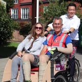 Alan Mak MP, Cycling Without Age volunteer co-ordinator Jenni Van Wijk and lead volunteer Roger Knight