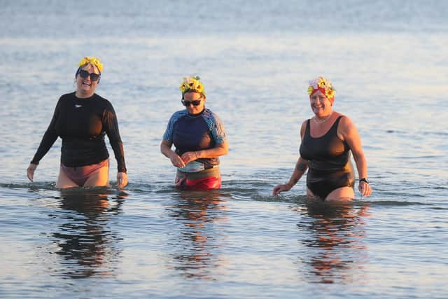 Sam Hope (43) from Lee-on-the-Solent, Elin's boyfriend of three years' mum, is now raising money for Lepra UK in memory of Elin by taking a dip in the ocean every day for a year. Her 200th dip took place on Friday, September 16, at Hill Head beach.
Pictured is: (right) Elin's mum Deryn Martin during the dip.
Picture: Sarah Standing (160922-867)