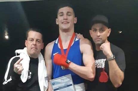 Mateusz Bereznicki celebrates a win with his coaching team