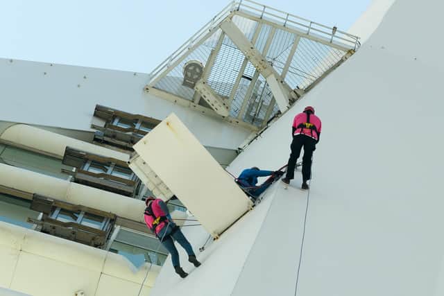 Neil White and Matt Crofts abseiling down the Spinnaker Tower. Picture: Keith Woodland (220421-7)