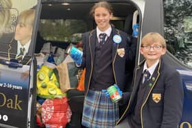 Boundary Oak Year 7 pupils Winnie Ball and Max Pestell deliver food supplies to a food bank in Fareham