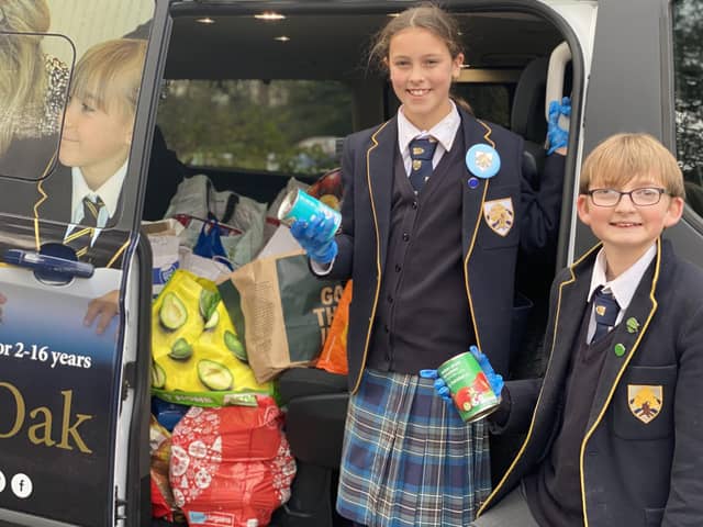 Boundary Oak Year 7 pupils Winnie Ball and Max Pestell deliver food supplies to a food bank in Fareham