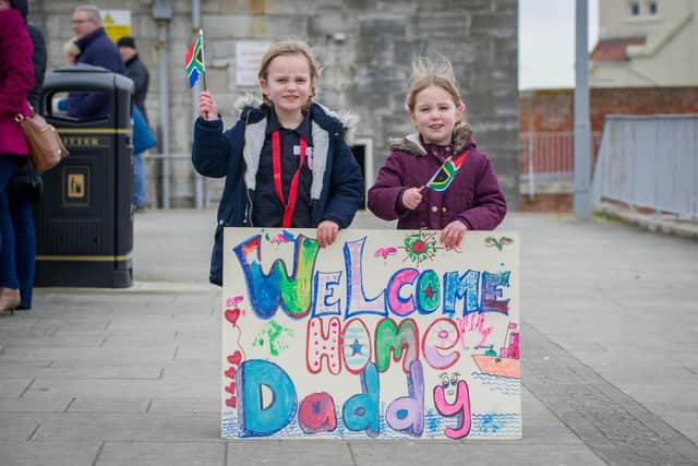 Pictured: Alice Jones, five, and Hanna Jones, four,  waiting for their father, Stuart Jones, at Portsmouth's Hot Walls.
Picture: Habibur Rahman