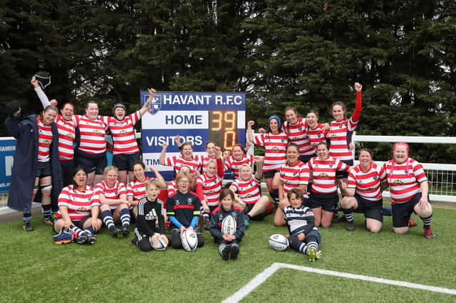 Havant Ladies Sirens celebrate their fine season finale whitewash win over leaders and rivals Portsmouth Valkyries 2nds in front of the scoreboard Picture: Dave Haines