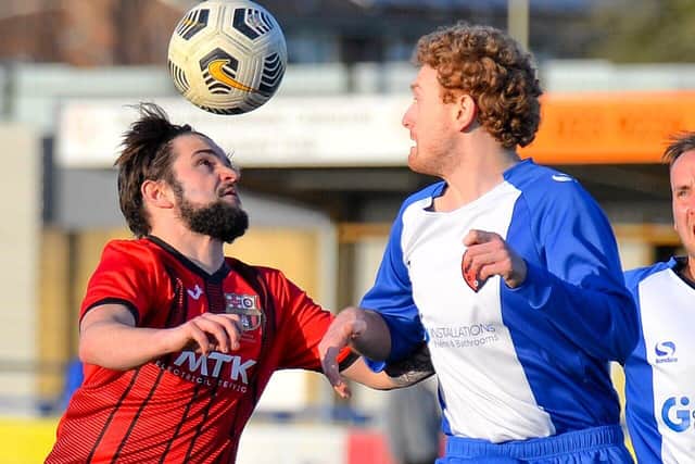 Horndean's Pete Snaith, left, with Rowner's Alex Hall. Picture: Martyn White.