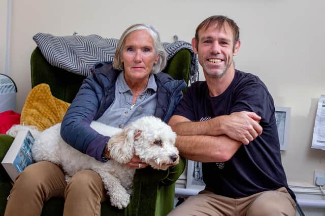 Andrew Campbell with his mum, Kate Stubbs and her dog, Simba at their home in Southsea on Monday 3rd October 2022

Picture: Habibur Rahman