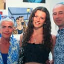 Art scholar Tabby proudly displays her work accompanied by her parents