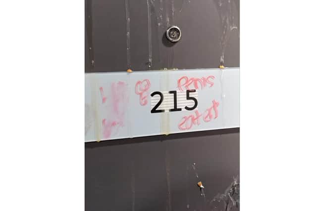 The students' flat door was pelted with eggs - and defaced with homophobic graffiti believed to be aimed at several gay and bisexual occupants. Picture: Liam Sangster
