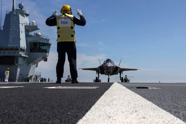 Pictured: A Senior Rate marshalls an F35.