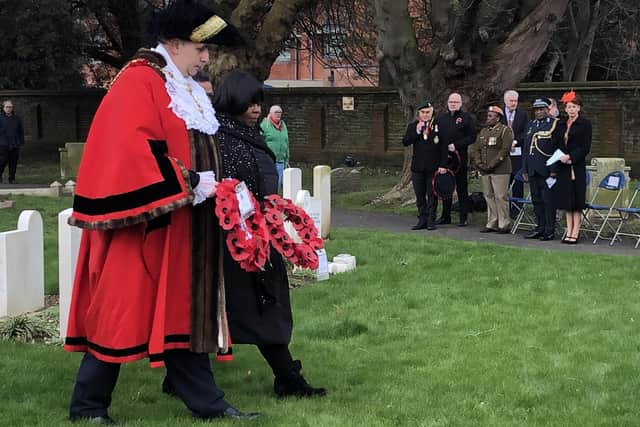 The Lord Mayor of Portsmouth, Councillor David Fuller, with the South African high commissioner Nomatemba Tambo lay wreaths on nine graves of SS Mendi victims in Milton. Photo: Tom Cotterill