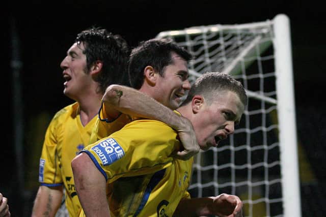 Tony Taggart is congratulated after his FA Cup winner at Notts County