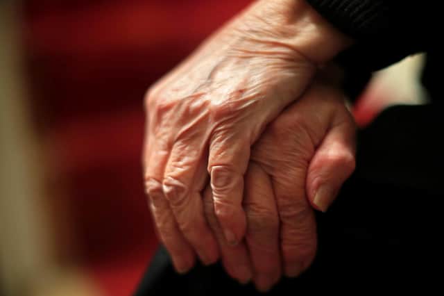 The hands of an elderly woman in Poole, Dorset.                                                                                                             