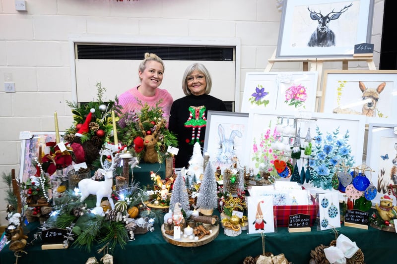 Helen Brown and Sandy Mitchell selling Christmas decorations and original paintings at the Wickham Christmas Fayre