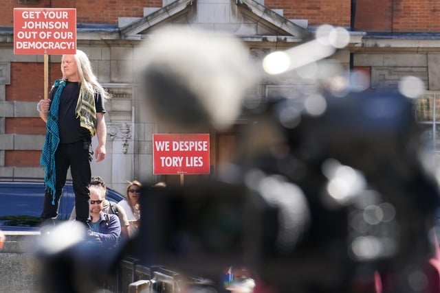 Protesters near College Green outside the Houses of Parlliament, London, following the resignation Boris Johnson. Picture date: Thursday July 7, 2022.