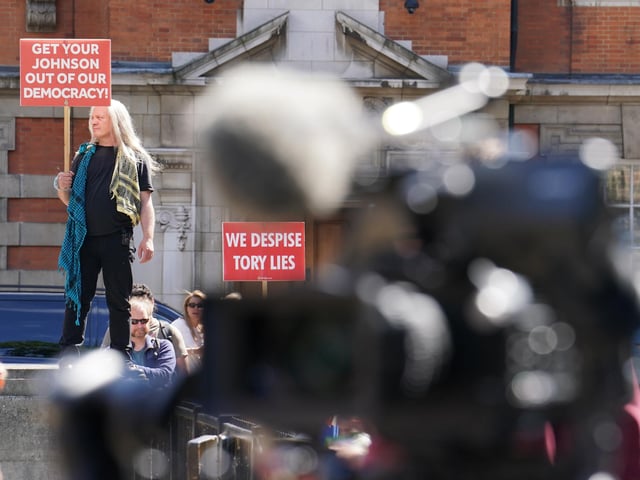 Protesters near College Green outside the Houses of Parlliament, London, following the resignation Boris Johnson. Picture date: Thursday July 7, 2022.