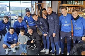 Two year old Rio Carraher met Portsmouth FC players in Starbucks. 

Pictured: From L to R: Zak Swanson, Owen Dale, Colby Bishop, Ryan Tunnicliffe, Simon Bassey (interim manager next to child), Sean Raggett, Reeco Hackett, Connor Ogilvie, Denver Hume and Joe Morrell stood with Rio Carraher in the middle.