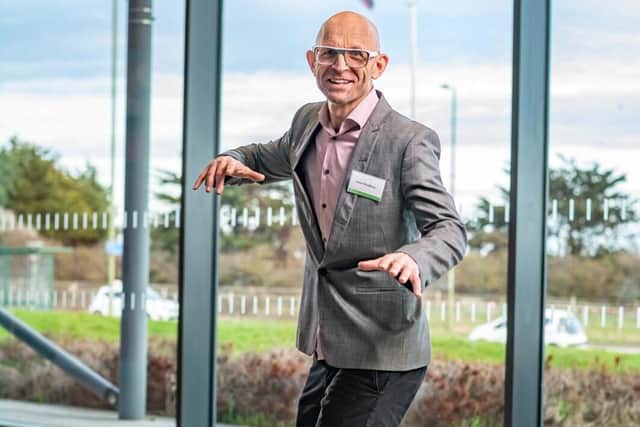 Jason Bradbury arriving on a hoverboard